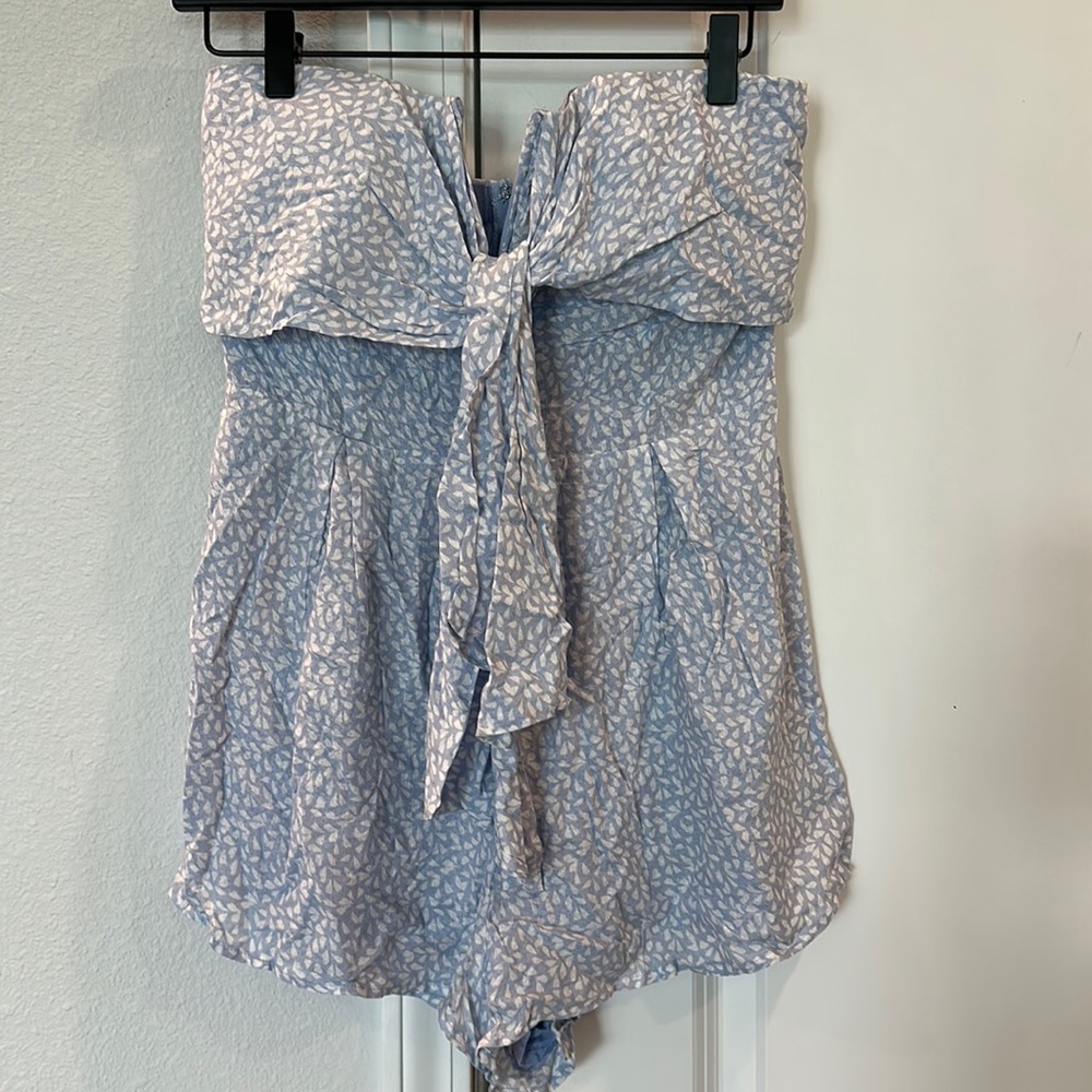 NWT Blue Blush strapless Romper. Size Large. Never worn. Light Blue color.